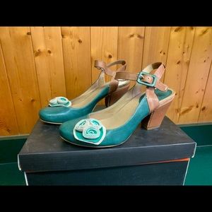 Chocolate leather shoes (one with puppy damage).